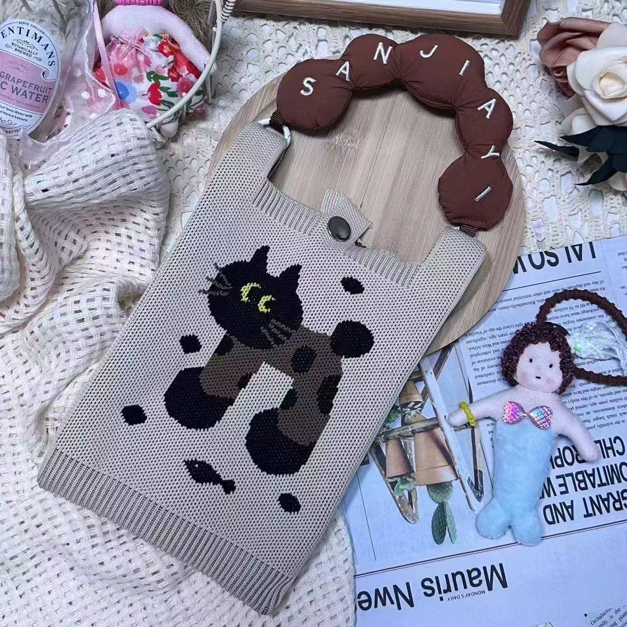 手柄包→米色波点猫（送肩带）