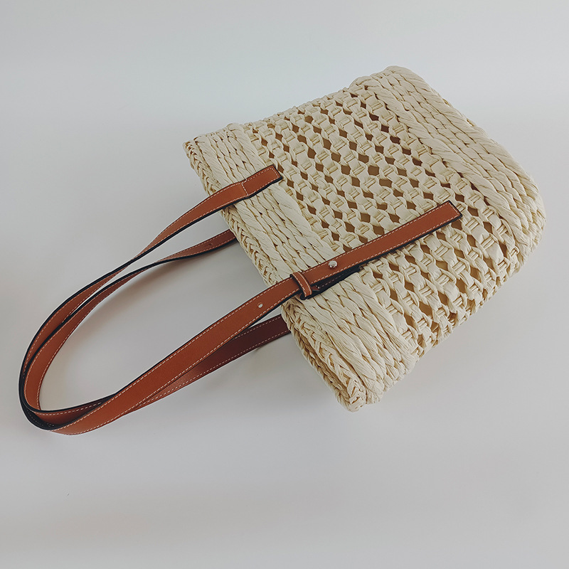 Straw woven bag women's 2026 new hollow handmade woven bag style single shoulder handbag seaside vacation beach bag